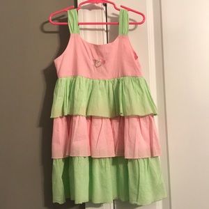 Child’s pink and green ruffle dress.